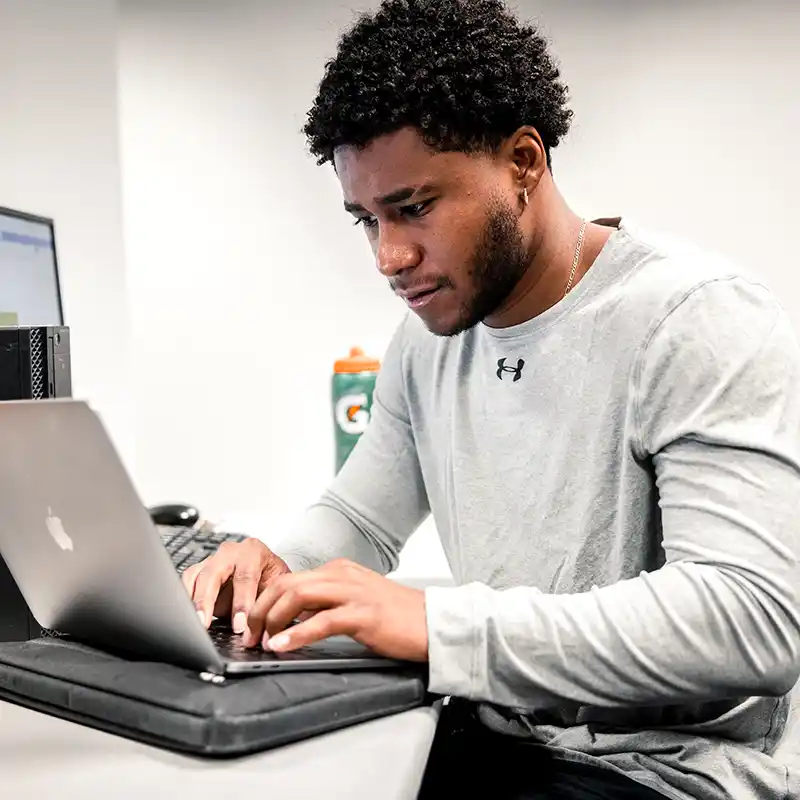 WT Student Working on a Laptop