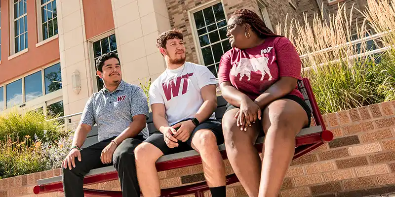 WT Students Seated on a Bench