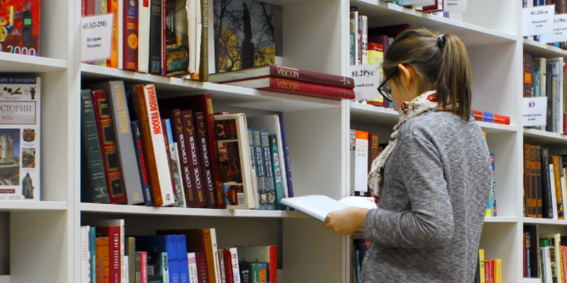 student in library