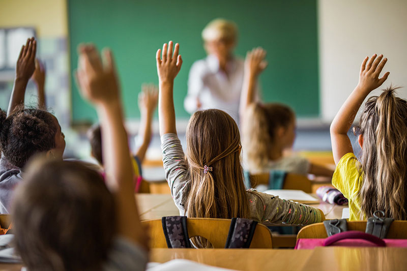 kids raising hands