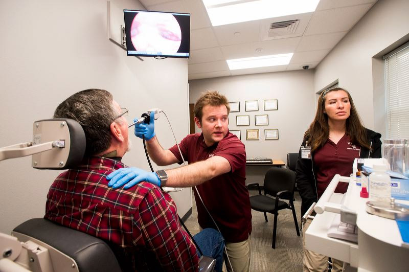 student performing an evaluation on another student