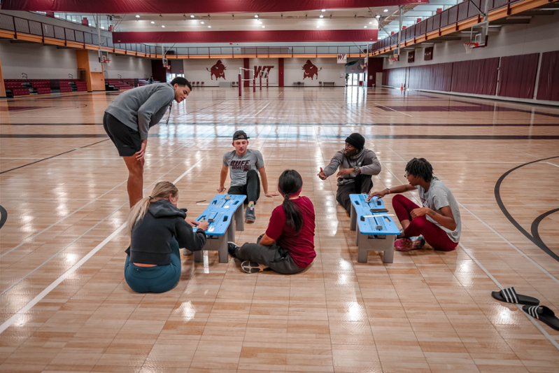 ses-grp-students-sit-stretch-all-purpose-room-2022