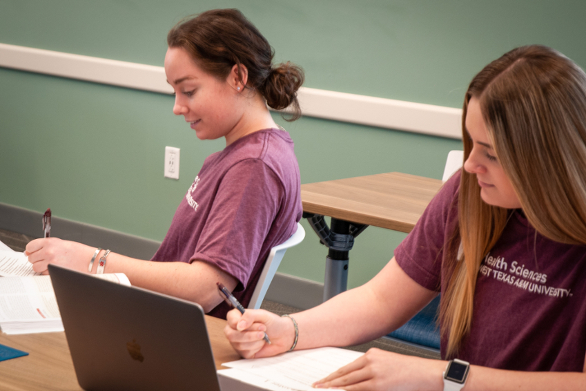 RellisHS_female_students_laptop_desk1