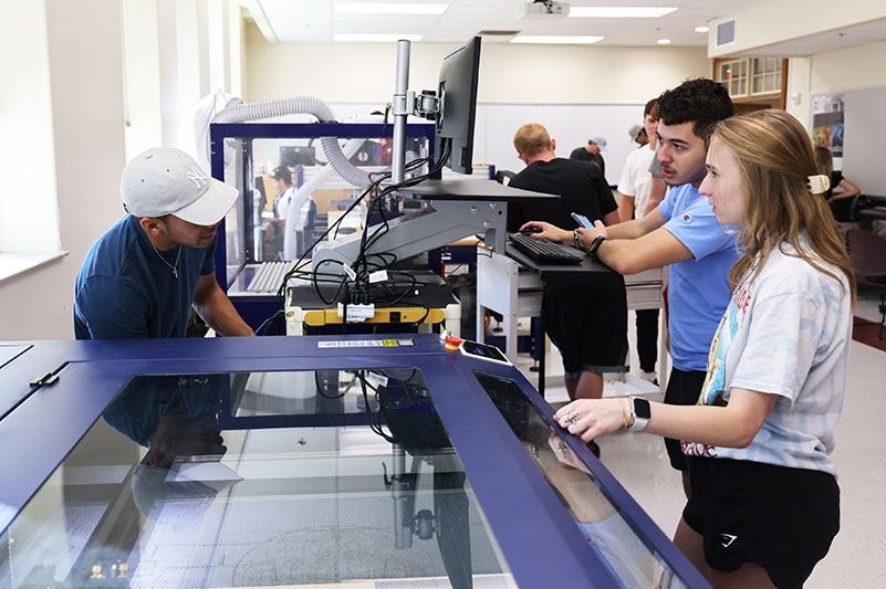 students-engineering-lab-working-on-machine