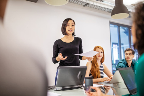 female-student-talking-to-group