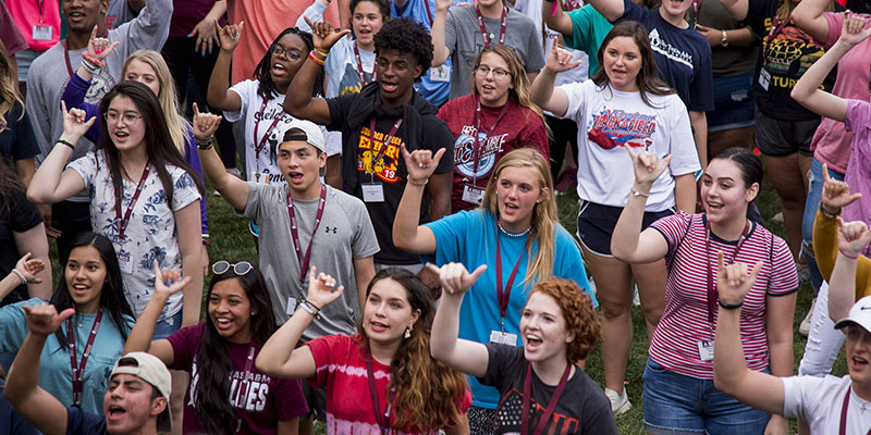 students showing buff hand signal